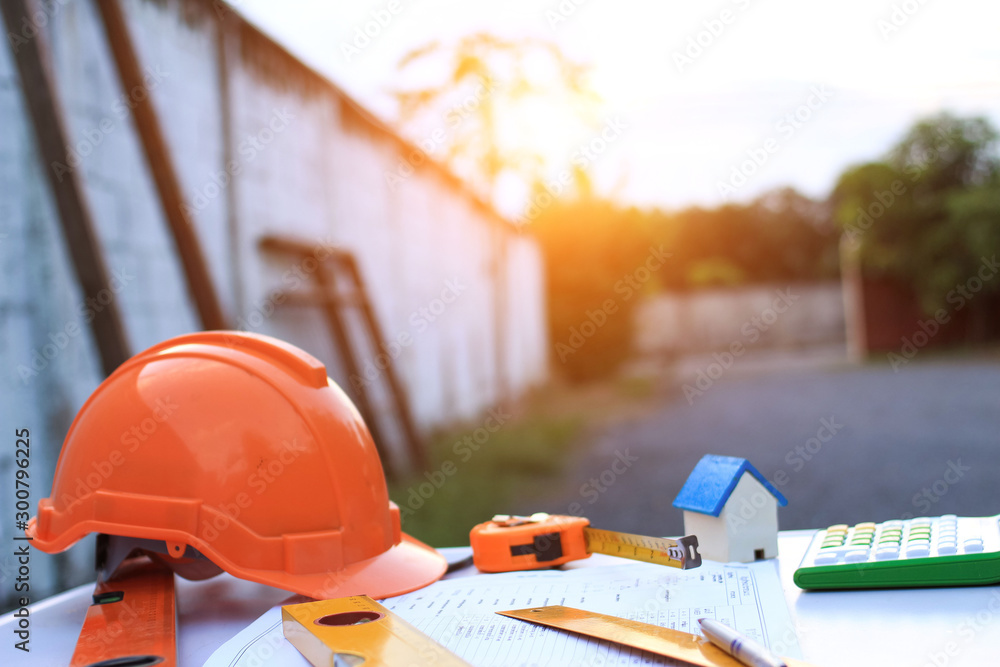 Desk of Architectural working home project in construction site,With drawing equipment concept. Desk of Architectural working home project in construction site,With drawing equipment concept.
