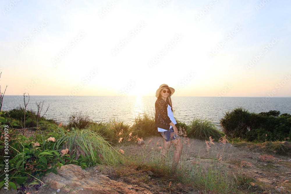 Portraits of young women wearing black glasses before the sun sets at Kaoh Samet, Thailand.