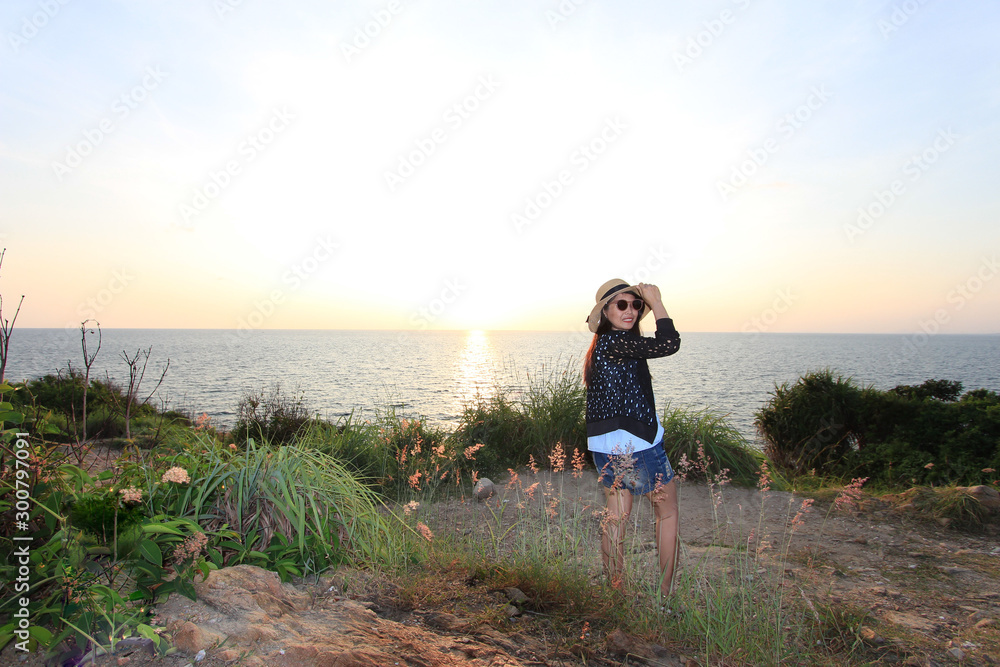 Portraits of young women wearing black glasses before the sun sets at Kaoh Samet, Thailand. Portraits of young women wearing black glasses before the sun sets at Kaoh Samet, Thailand.