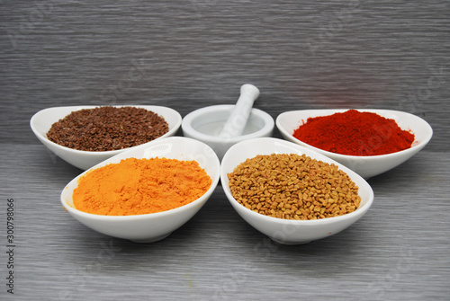 Fototapeta Naklejka Na Ścianę i Meble -  Healthy Spices - Flax Seed Turmeric, Fenugreek, and Chili Powder,
