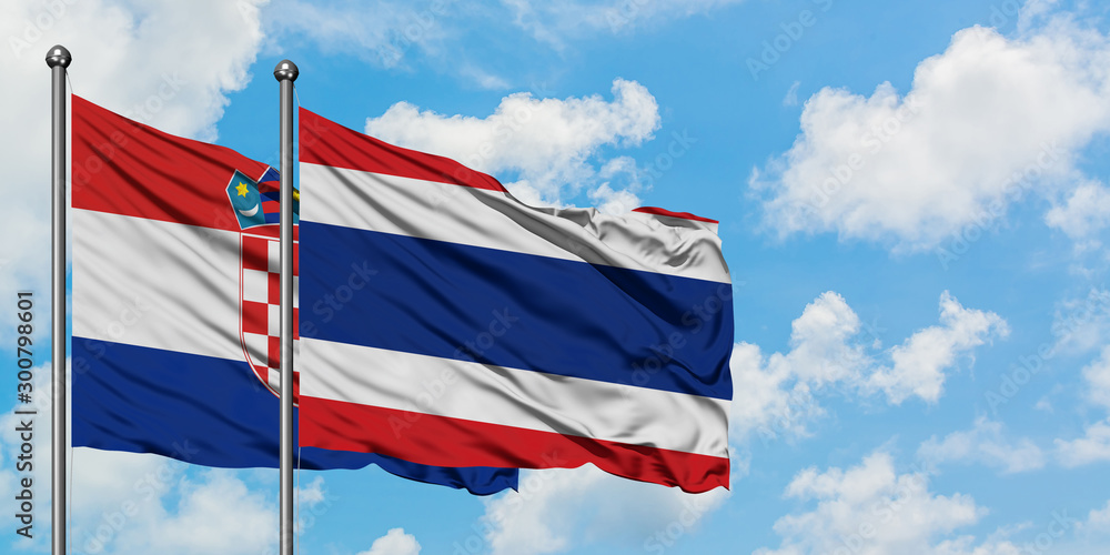 Croatia and Thailand flag waving in the wind against white cloudy blue sky together. Diplomacy concept, international relations.