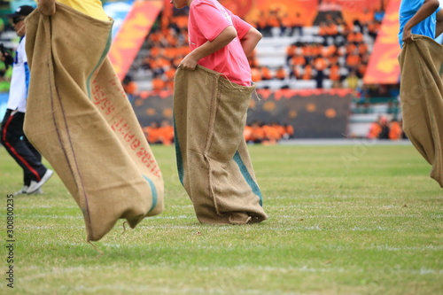 Student play running sack during sports day.
