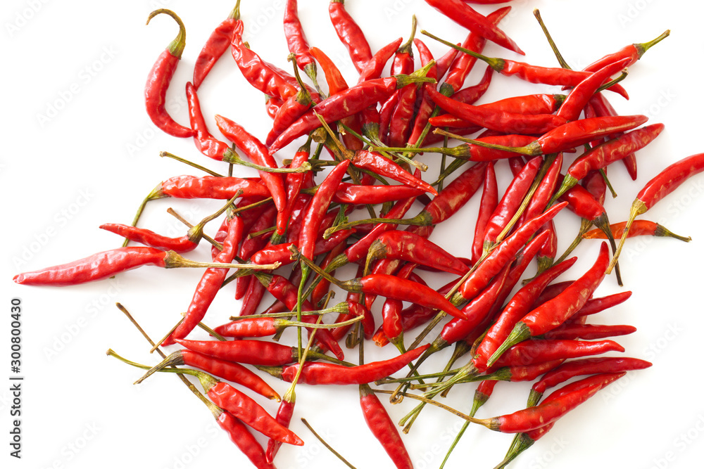 Fototapeta premium Close-up of bright red Thai bird chiles isolated on a white background