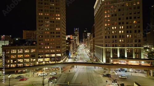 Detroit Michigan Aerial v157 Low nighttime fly over cityscape of Woodward Avenue vantage to high, near vertical downtown and river views - October 2017 photo