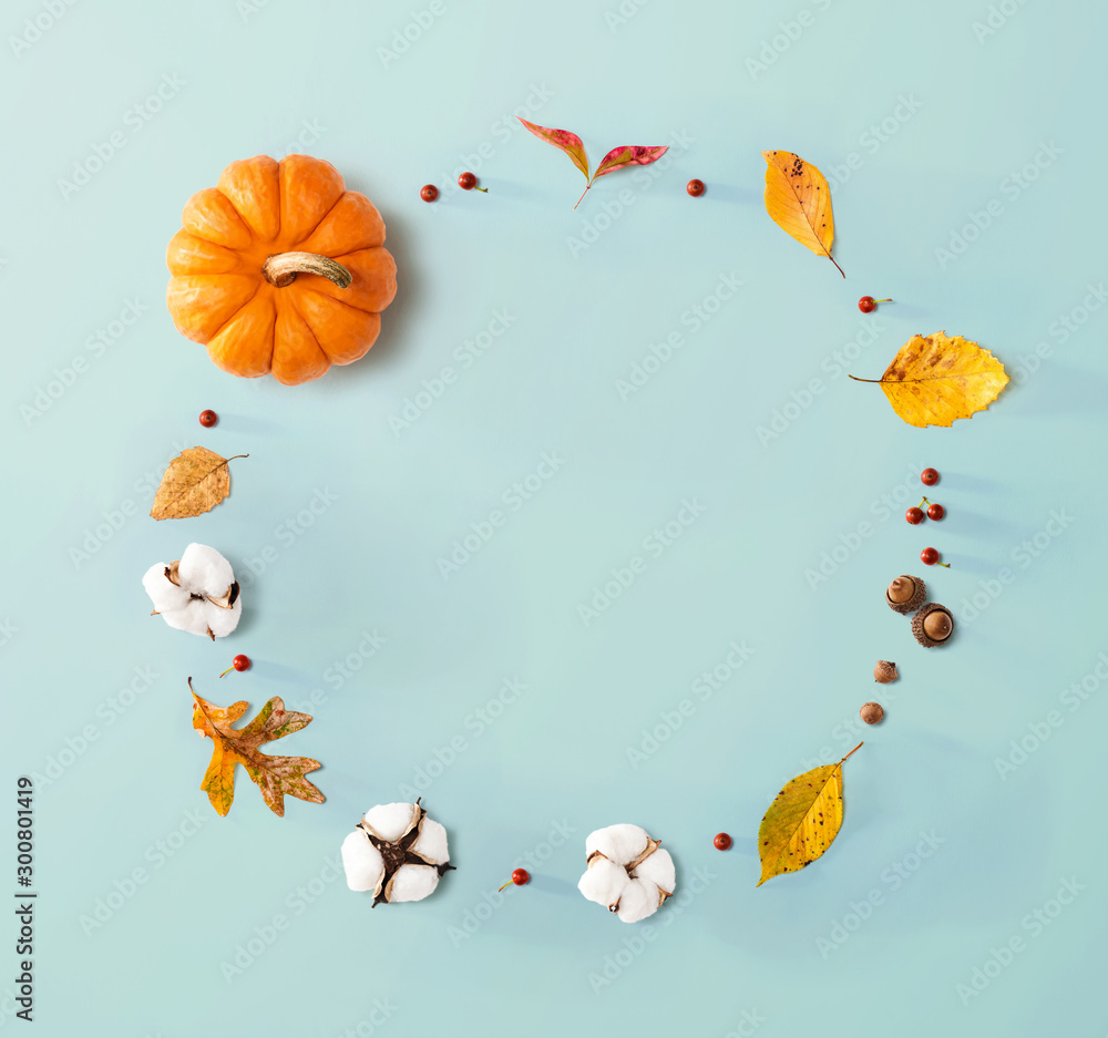 Autumn theme with orange pumpkin - flat lay