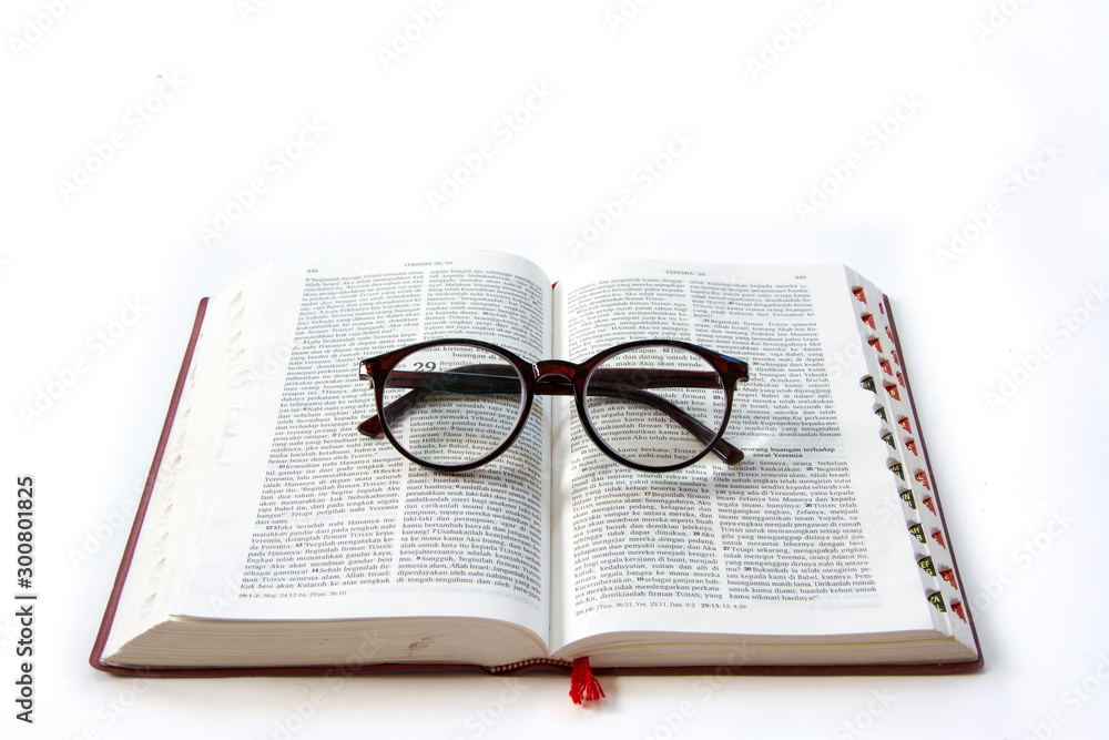 Open Holy Bible In Bahasa Indonesia On White Background With Glasses Stock Photo Adobe Stock