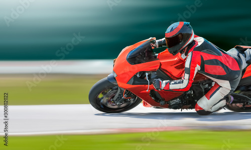 Motorcycle leaning into a fast corner on race track