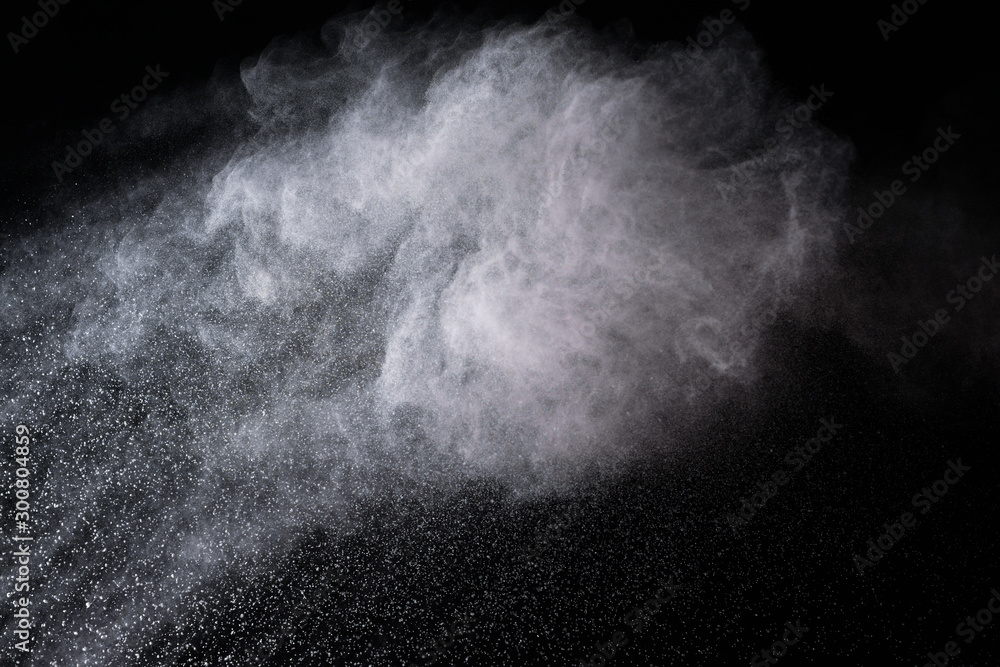 abstract white dust explosion on a black background. 