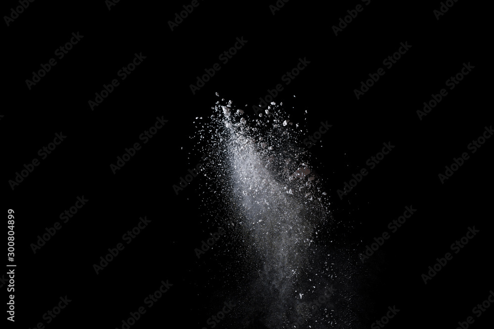 abstract white dust explosion on a black background. 