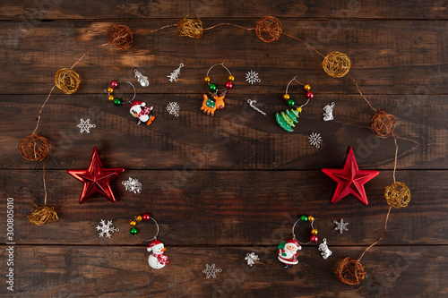 Christmas decorations arranged on wooden background - top view with copy space