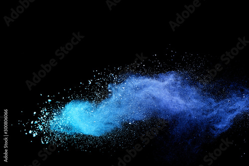 Blue sky color powder explosion on black background. photo
