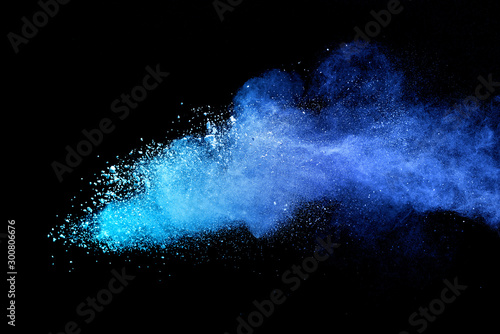 Blue sky color powder explosion on black background.