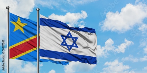 Congo and Israel flag waving in the wind against white cloudy blue sky together. Diplomacy concept, international relations.
