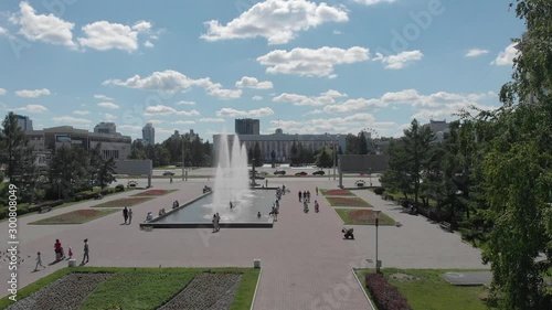 Barnaul, Altai Krai / Russia: 06.25.2019 The drone takes a bird's eye view of the city center with a view of the central square and the city administration. Ploshchad' Sovetov photo