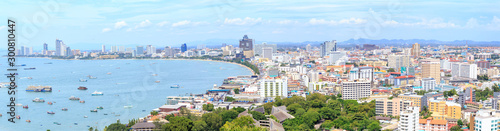 Panorama landscape photo of Pattaya cityscape and bay or harbor at Chonburi Province, Thailand. © Phongsak