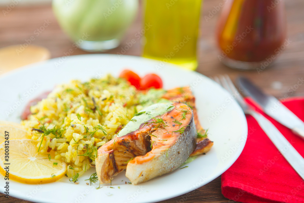 Rise noodles with salmon and vegetable on wooden table Rise noodles with salmon and vegetable on wooden table