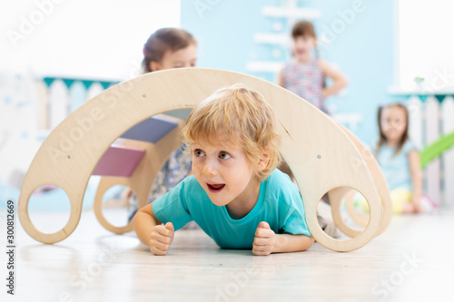 Cute child playing in kindergarten or daycare