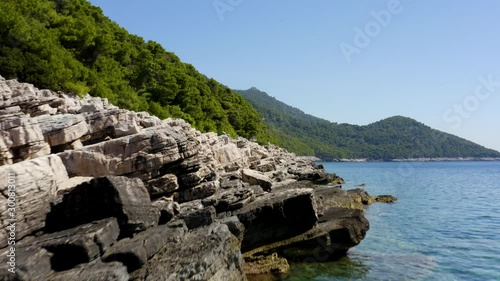 from Sea level to stunning Panorma View of the Aleppo Pine Tree Island of Mljet in Croatia (aerial) photo