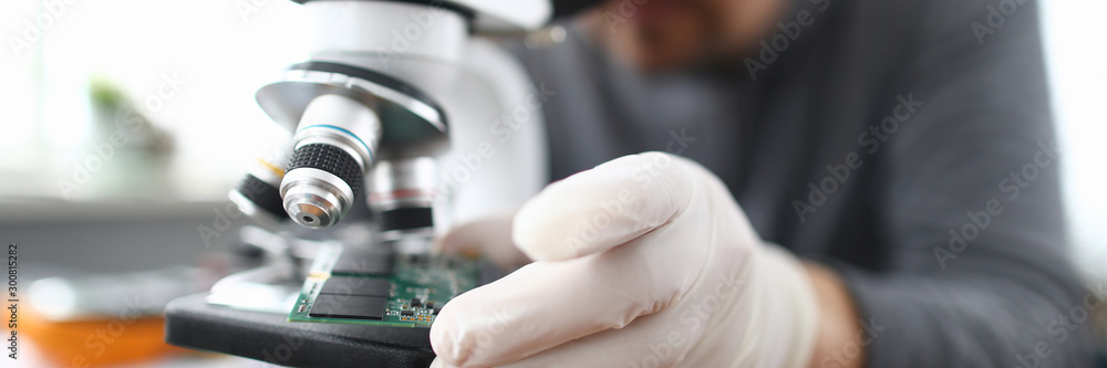 Male worker pc repair service in white protective Male worker pc repair service in white protective