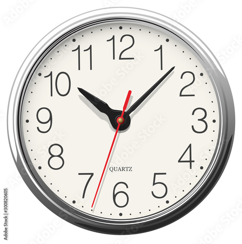 Round wall clock with glossy metallic body placed on white