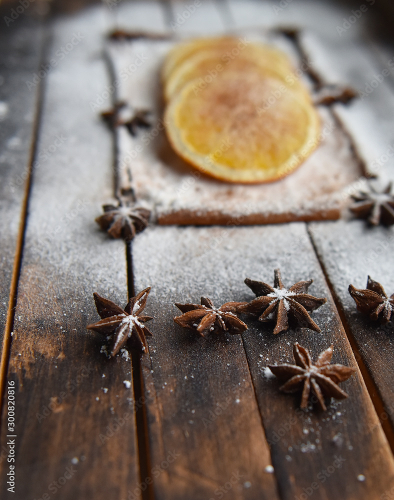 Christmas still life of dried oranges, cinnamon, star anise powdered sugar Christmas still life of dried oranges, cinnamon, star anise powdered sugar