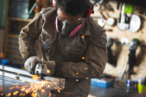 Photography Professional technicians grinding the metal table