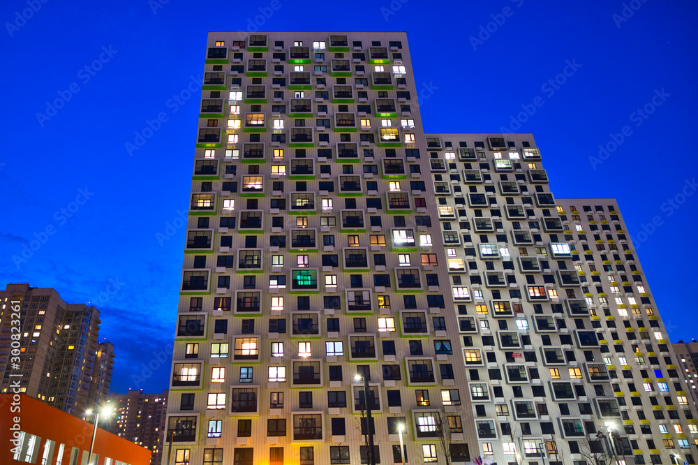 Fototapeta premium Several residential high-rise buildings at night