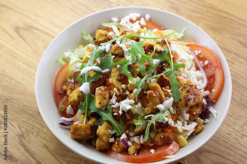 Delicious chicken salad in a white plate. Delicious chicken salad in a white plate.