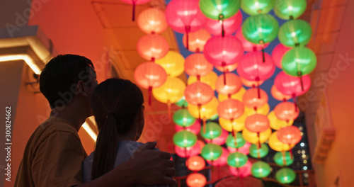 Asian couple look at the chinese lantern together