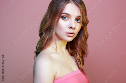Beautiful young blond woman in pink
