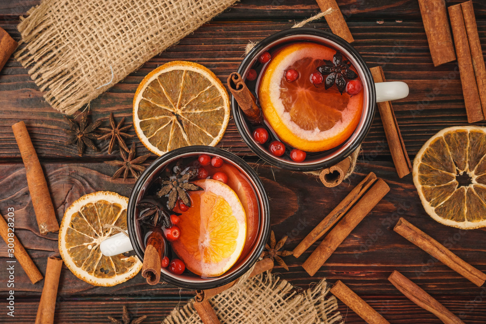 Christmas composition with hot mulled wine in rustic cup Christmas composition with hot mulled wine in rustic cup