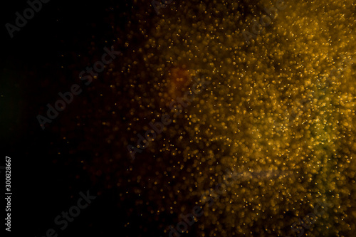 Abtract gold bokeh on black
