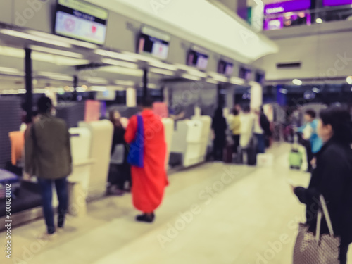 Blur image of many people at the airport counter, prepare to travel
