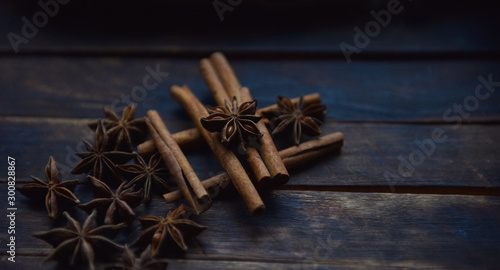 Fototapeta Naklejka Na Ścianę i Meble -  Cassia sticks and star anise on a brown background