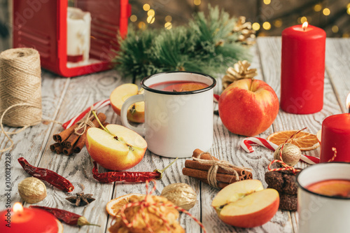 Oatmeal cookies on a old wooden background with cinnamon sticks and decorations