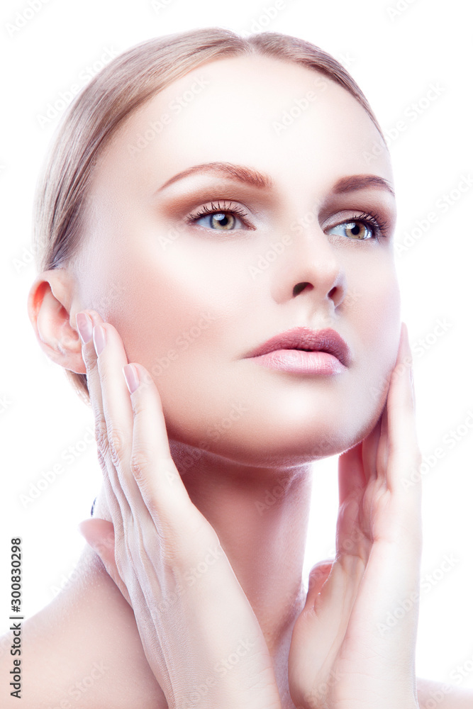 Beautiful famodelm bauty face, hands apply cream cosmetics, nude natural make-up, perfect skin. Isolated. White background. Skincare facial treatment concept Beautiful famodelm bauty face, hands apply cream cosmetics, nude natural make-up, perfect skin. Isolated. White background. Skincare facial treatment concept