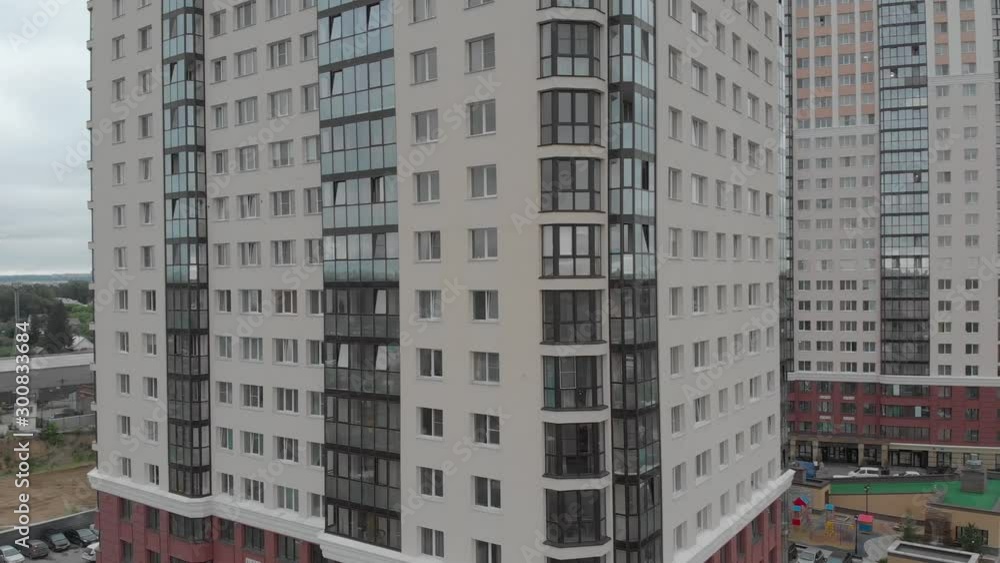 A drone flies over a two-story elite village near the city of Novosibirsk. Overlooking the car, street, and forest. A drone flies over a two-story elite village near the city of Novosibirsk. Overlooking the car, street, and forest.