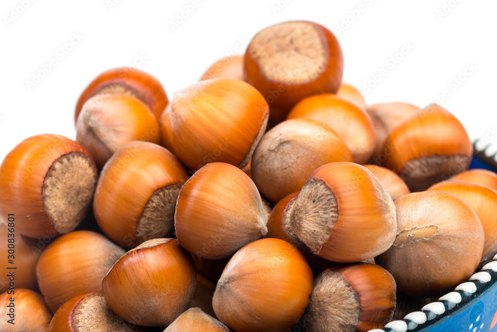 Hazelnuts in bowl isolated on white background - Image Hazelnuts in bowl isolated on white background - Image