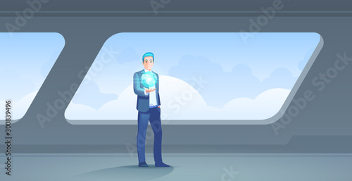 Future Global communications technology concept. Businessman Holding holographic model of Earth planet in hand standing in modern interior Vector illustration.