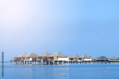 Fototapeta Naklejka Na Ścianę i Meble -  Maldives is famous beautiful sea, clear sky, villas or resorts located in the middle of the sea, each is connected by a long bridge, elegant, peaceful and privacy, good for lover who come to honeymoon