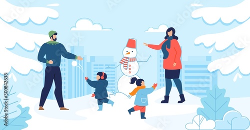 Mom and Dad with Kids Enjoy Winter Fun Together