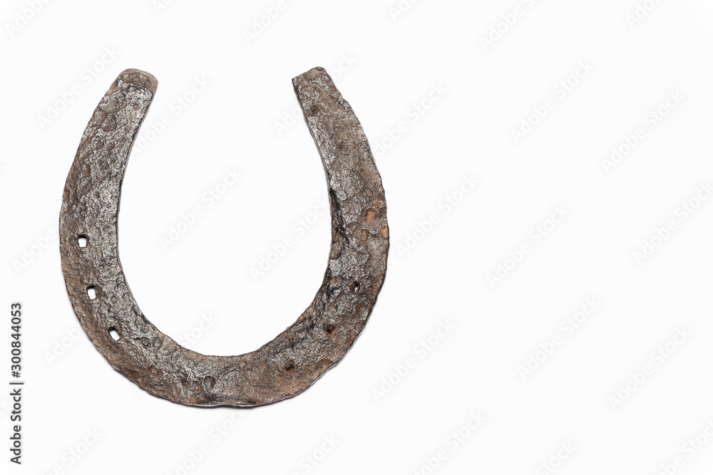 Isolated rustic top of Horseshoe, left side of frame, isolated on a white background. Isolated rustic top of Horseshoe, left side of frame, isolated on a white background.