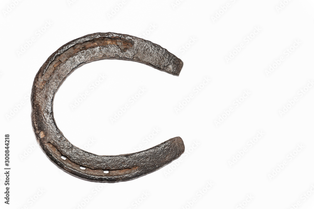 Isolated rustic Horseshoe bottom, resting on its side. Isolated rustic Horseshoe bottom, resting on its side.