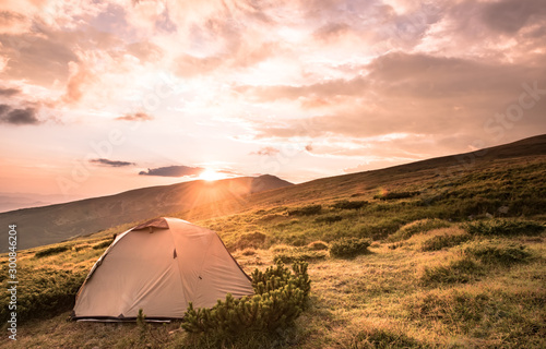 Camping tent in morning sun ray. Active lifestyle. Tatra mountains Zakopane, Poland