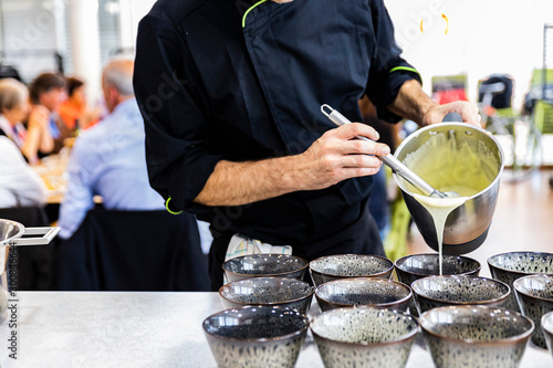 Chef preparing food for his clients photo