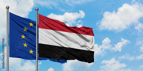 European Union and Yemen flag waving in the wind against white cloudy blue sky together. Diplomacy concept, international relations.