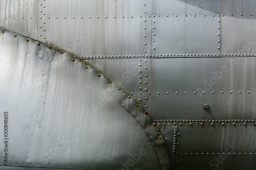 Aluminum sheet and rivet fastening. Aviation background.