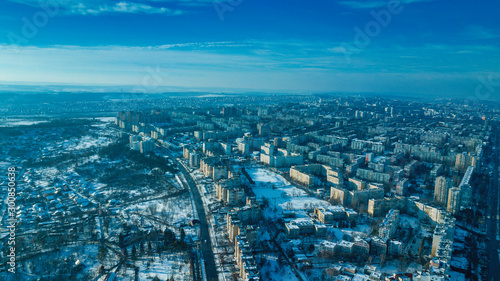 Top view of city in winter at sunset on sky background. Aerial drone photography concept. Kishinev, Republic of Moldova.