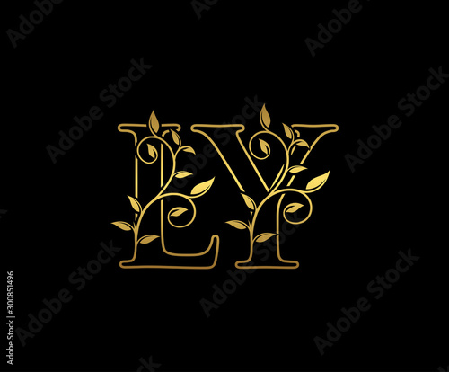 Golden letter L and Y, LY vintage decorative ornament emblem badge, overlapping monogram logo, elegant luxury gold color on black background.