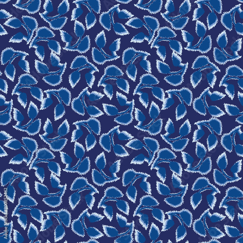 A seamless vector pattern with indigo blue leaves. Surface print design.